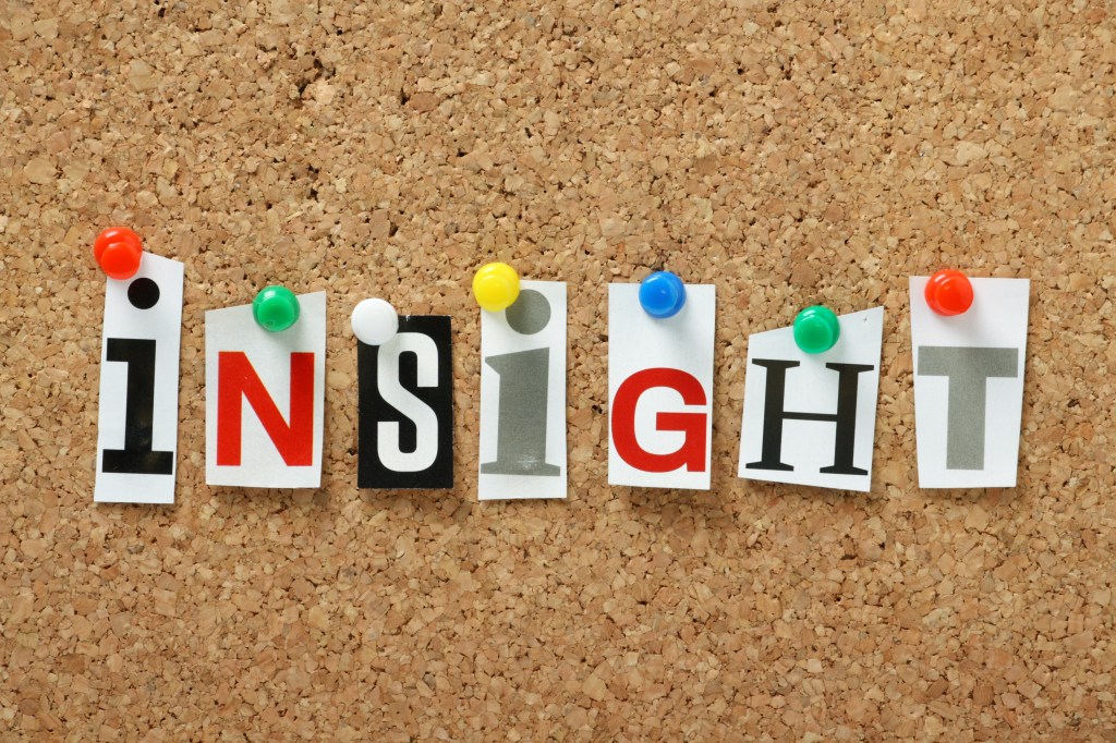The word Insight on a cork notice board